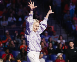 Amy Smith with her hands in the air