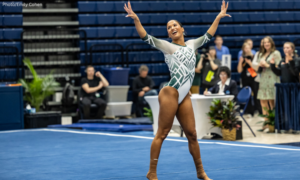 Skyla Schulte dances with arms raised and spread wide