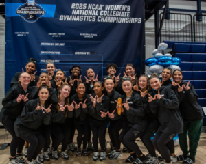 Michigan State takes a team photo after qualifying to national championships in Fort Worth