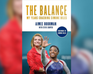 The cover of Aimee Boorman's book The Balance: My Years Coaching Simone Biles overlayed with a background.