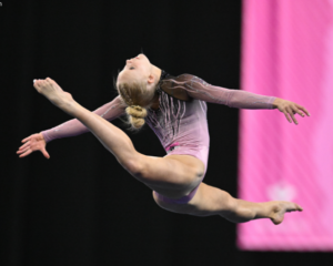 Kennedy Cochran performs a leap on the floor exercise