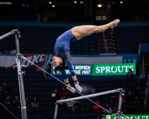 Frida Esparza performs a Maloney on bars