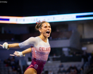Jordan Bowers celebrates after a bar routine