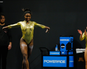 Chae Campbell wears a gold leo