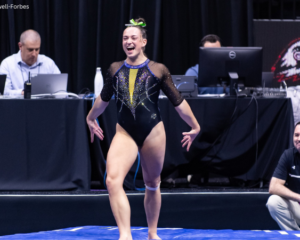 Mia Nelson of San Jose State triumphantly finishes her tumbling pass.