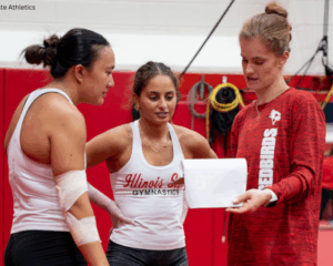 Illinois State head coach Cassandra Ringer speaks to two athletes