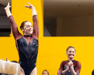 Emma Slevin salutes after her beam routine.