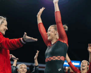 Cécile Canqueteau-Landi congratulates Emma Mason after her beam routine.