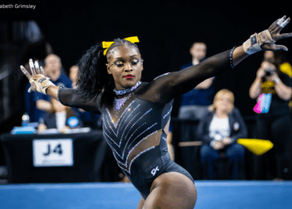 JerQuavia Henderson dances in the corner during her floor routine with outstretched arms