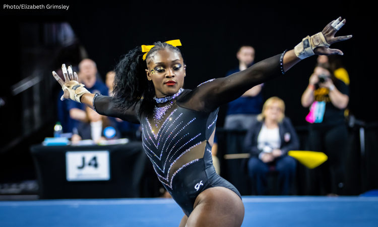 JerQuavia Henderson dances in the corner during her floor routine with outstretched arms