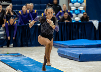 Kailin Chio runs toward the vault with her arms and legs in motion