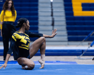 Oshkosh gymnast Reanna McGibboney poses on the floor.