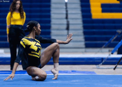 Oshkosh gymnast Reanna McGibboney poses on the floor.