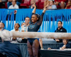 Selena Harris-Miranda salutes before beam.