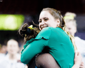 Alaska head coach Marie-Sophie Boggasch gives one of her gymnasts a hug