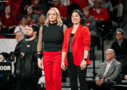Georgia coaches Cécile Canqueteau-Landi and Marissa King stand side by side.