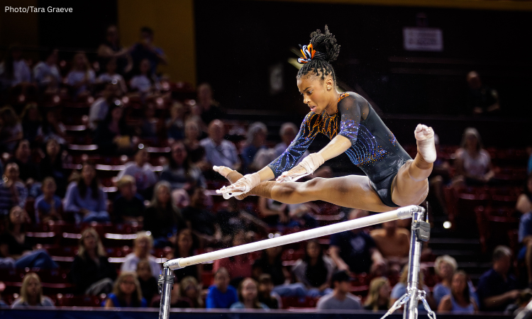 Anya Pilgrim flies above the bars right before making a catch on her release.