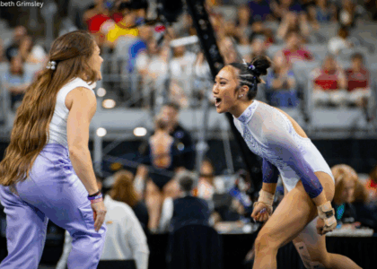 Kailin Chio and Courtney McCool Griffeth celebrate on the floor.