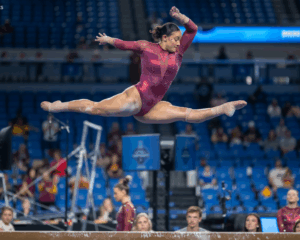 Luciana Alvarado-Reid does a leap on beam