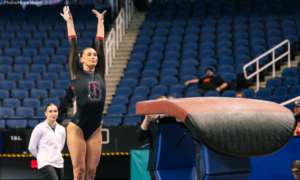 Summer Gronski salutes after landing her vault.