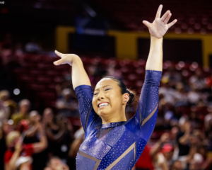Abbey Scanlon emotionally salutes after her final beam routine.