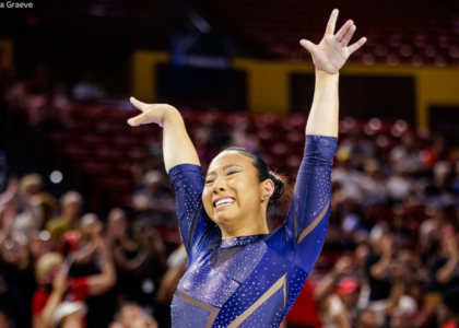 Abbey Scanlon emotionally salutes after her final beam routine.