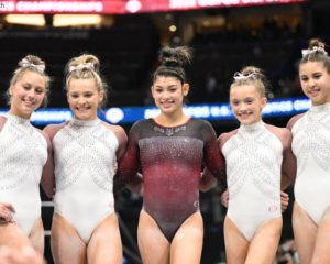 A group of gymnasts pose together