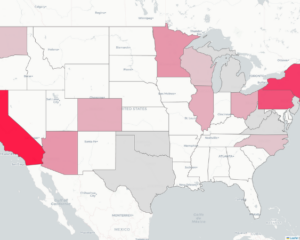 Screenshot of a U.S. map shaded in varying shades of pink for the "Geography of Gymnastics: In-State Incoming Freshmen" feature. States are colored from light to dark pink to represent the relative number of incoming NCAA gymnastics freshmen competing in their home state, with darker shades indicating more athletes. California, New York, and Pennsylvania are among the darkest-shaded states, while several other states across the Midwest, Northeast, and West are shaded lighter. Most states remain unshaded.